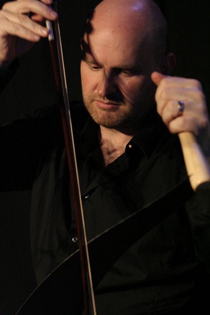 Julian Ferraretto close up with violin and bow